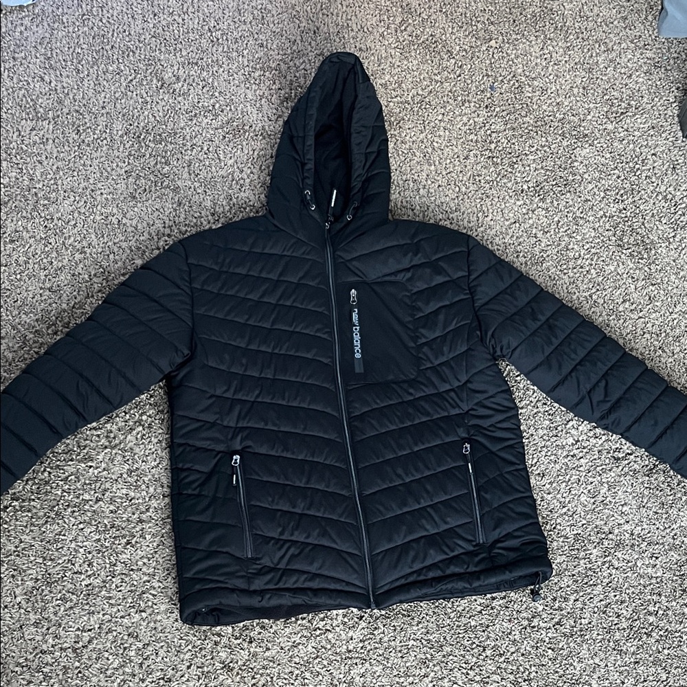 New Balance Men's Black Puffer coat with reflective new balance sign on sleeve